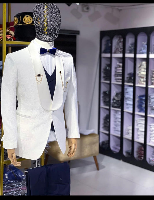 Ivory shawl lapel tuxedo with blue waistcoat and blue tux pants